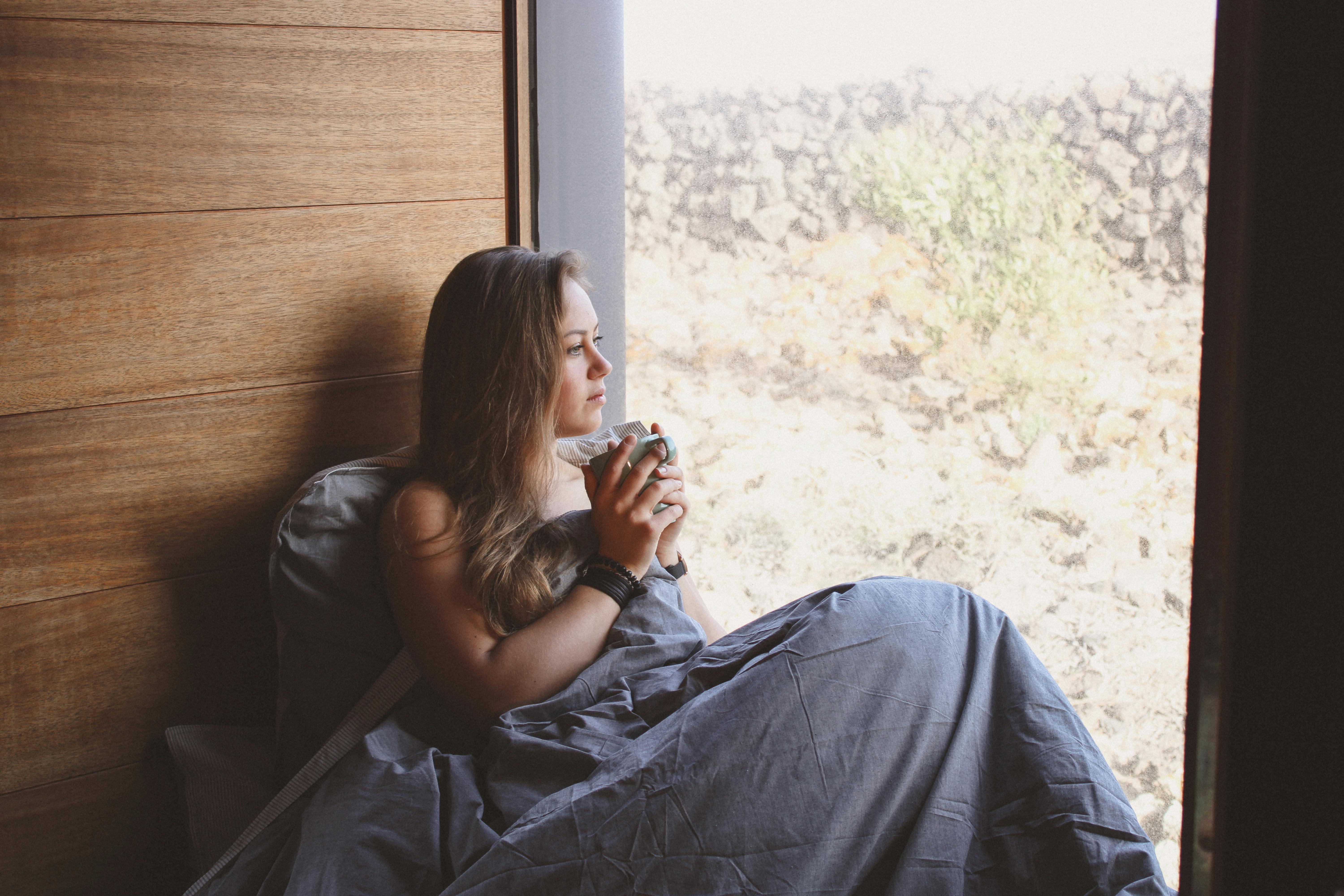 Calm moment by the window with a warm drink